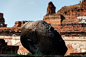 Ayutthaya, Thailand. Wat Mahathat, a Buddha head of the gallery enclosing the collapsed central prang.